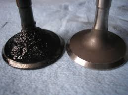 Two Valves Compared - One With Carbon Deposits And One With None
